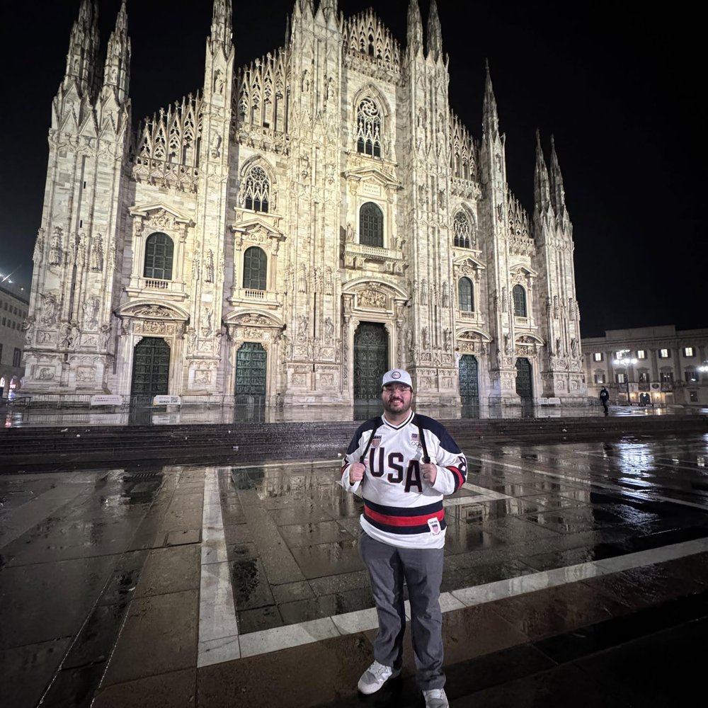 Thomas Lopez in USA gear outside the Duomo di Milano at the 2026 Winter Olympics